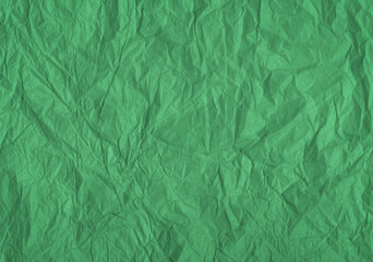 Obraz premium Wrinkled green color paper texture. Old crumpled wavy paper antique background. 