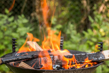 Fire burning in a barbecue close-up.