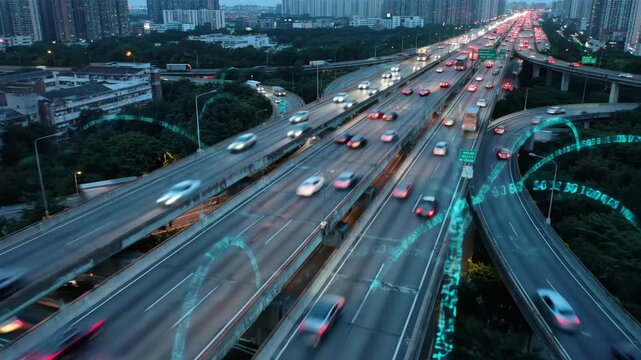 Aerial view of a multi lane highway with cars at dusk with soft evening lighting and green trees with apartment buildings in background.