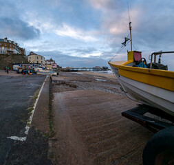 Fishing boat used to catch crabs moored on the beach. Captured in the seaside town of Cromer, North Norfolk coast. Wide angle view