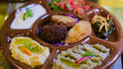 Traditional Egyptian mezze platter featuring falafel, dips, and fresh salads, enjoyed during a cultural travel experience.