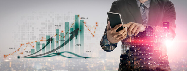 A businessman interacts with a smartphone while standing in front of a financial growth chart overlaying an urban cityscape, showcasing modern investment strategies and technology. Scalp
