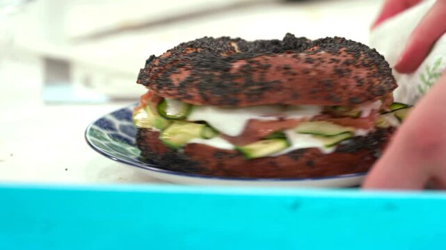 a tasty stuffed bagle is almost ready to be eaten
