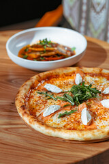 Gourmet Salmon Pizza with Cream Cheese and Fresh Arugula, Dining Scene