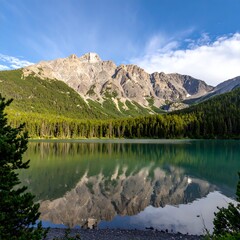 Mountain lake reflecting a serene sky