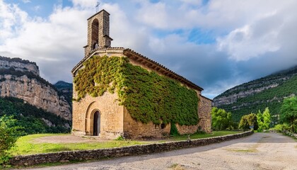 Fototapeta premium chapel of nuestra senora de los dolores in fanlo with rustic stone facade ivy covered walls and historic charm in ordesa aragon spain