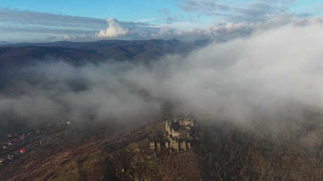 Scenic drone footage in late autumn over the Soimos Fortress in Arad County, Romania, Europe	