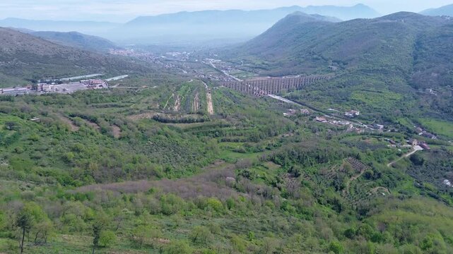 aerial view of Vanvitelli Aqueduct showcasing the breathtaking connection between mountains and historic engineering mastery