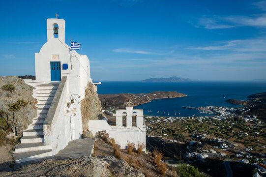 Agios Konstantinos greek orthodox church perched high on a cliff in the Chora of Serifos overlooking Livadi with Sifnos on the horizon
