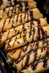 Crispy rolls with sesame and sauce