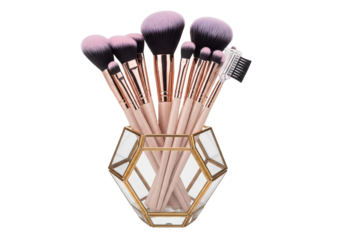 Professional rose gold cosmetic brushes in geometric holder png isolated on transparent background