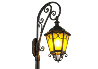 Elegant vintage ornate black street lamp with glowing warm yellow light, classic design, outdoor lighting, urban element png isolated on transparent background