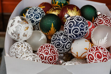 Colorful Christmas baubles with decorative patterns in festive market display