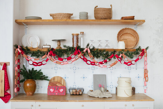 Christmas countdown calendar on a kitchen worktop with Christmas decorations