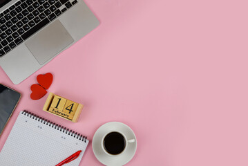 Workplace with blank notepad and smartphone on pastel background. Valentine day