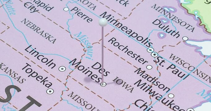 A zoom out of a white pin into Des Moines city of The United States of America political map