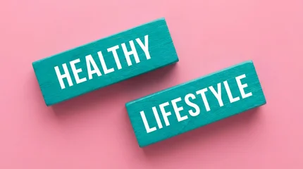Crédence de cuisine Citations Two teal colored wooden blocks with white text reading HEALTHY and LIFESTYLE are placed on a pink background wellbeing wellness motivation inspiration conceptual words messages quotes  © Mary Patricia