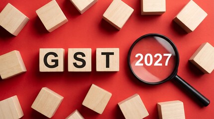Wooden alphabet blocks spelling GST are arranged next to a magnifying glass highlighting the year 2027 on a bright red background with scattered blocks Finance Tax Business Audit Inspection