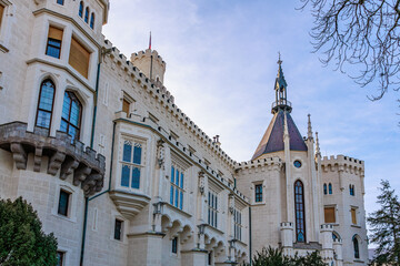 Majestic european castle with tower against blue sky in daylight