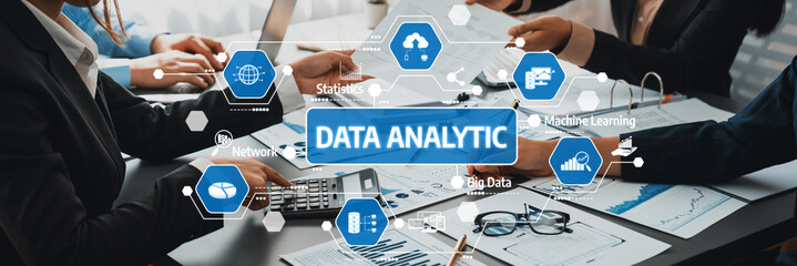 This image captures a dynamic team collaborating on data analytics, showcasing visual charts and machines that highlight modern business strategies and insights. Amity