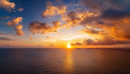Fototapeta premium Sunset Sky Cloud Background Over Sea In The Evening With Orange Yellow Gold Sunlight Sun Dawn In Golden Hour And Dramatic Fluffy Horizon Morning Sunny Sunrise Sea Summer Sky Landscape Dusk Sky