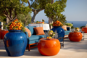 Vibrant Outdoor Terrace with Citrus Decor and Ocean View