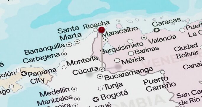 A zoom out of a red pin into Cucuta city of Colombia political map