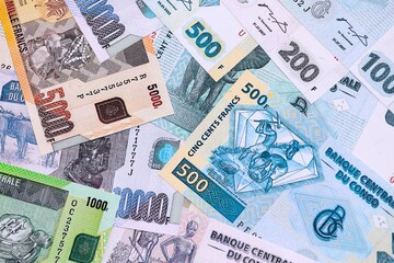 Congolese franc money bills in big amount on table close up. Rich life concept in Democratic Republic of Congo. Business and economy