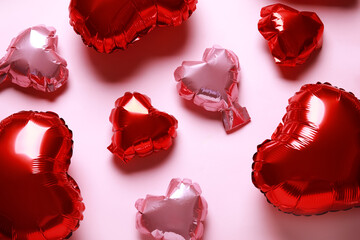 Heart shaped air balloons on pink background