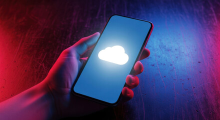 A hand holds a smartphone displaying a cloud computing graphic with red and blue lighting on a dark textured backdrop, symbolizing digital technology.