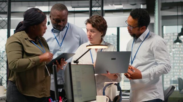 Engineering team working together in office, using specialized hardware to accelerate complex AI calculations. Coworkers cooperating, managing systems for machine learning training datasets, camera B