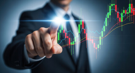 Close up of a man in black suit touching glowing financial chart, displaying stock market data analysis and economic growth on a dark background.