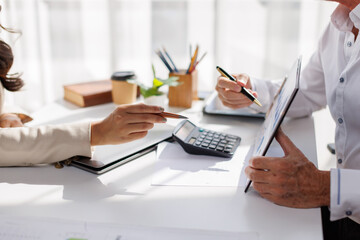 Team of business analysis documents in action office setting report generation professional environment strategic planning
