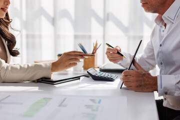 Team of business analysis documents in action office setting report generation professional environment strategic planning