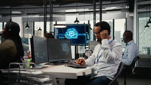 Engineering team in office providing remote diagnostics using artificial intelligence technology, troubleshooting technical faults. Workers managing support tickets, talking in headset mic, camera A
