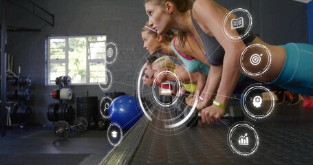 Performing group five adults wearing workout gear holding forearm planks at gym, with blue ball HUD