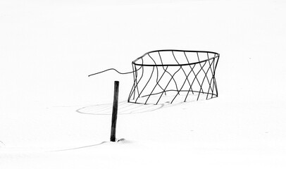 Wire guard floating on a snowy field