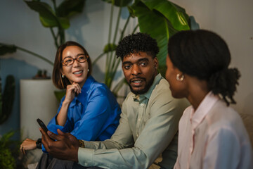 Diverse coworkers talking and networking during office break