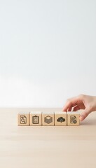 Hand Stacking Wooden Blocks with Business Words (Growth)