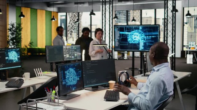 Technician listening music in office, using specialized hardware to accelerate complex AI calculations. IT expert wearing audio headphones managing machine learning training datasets, camera A