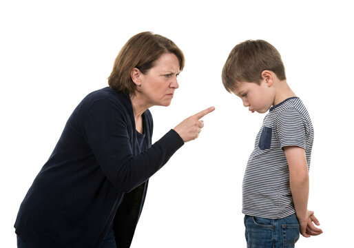 Mother scolding sad son with pointing finger. Family discipline