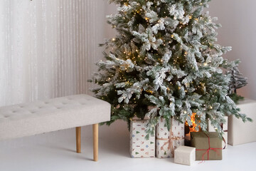 Decorating for Christmas with family, presents, and holiday spirit in a cozy living room with two Christmas trees