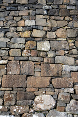 Fototapeta premium Restored old stone block building exterior wall, architecture detail background, Isle of Skye, Scotland, UK 