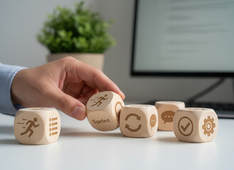 Agile methodology implementation and re-arranging the cubes quickly using wooden cubes, symbolic icons, human hand, natural depth of field, soft blurred background, minimal desk background..png