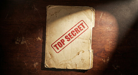 Top Secret Stamped Old File Folder on Wooden Desk
