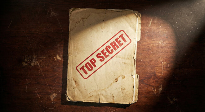 Top Secret Stamped Old File Folder on Wooden Desk