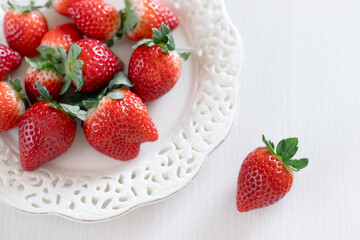 Fresh Strawberries on White Decorative Plate with Copy Space
