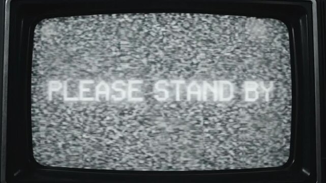 Retro Television Screen Displaying Please Stand By Message with Static Noise