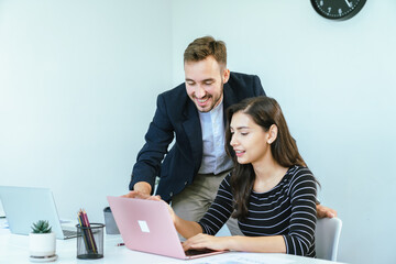 Business team analyzing data and marketing strategy in modern office, brainstorming ideas for project success using laptops and charts, teamwork collaboration for corporate growth