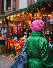 Christmas market with illuminated food stalls, gift shops and kiosks, New Year outdoor fair...